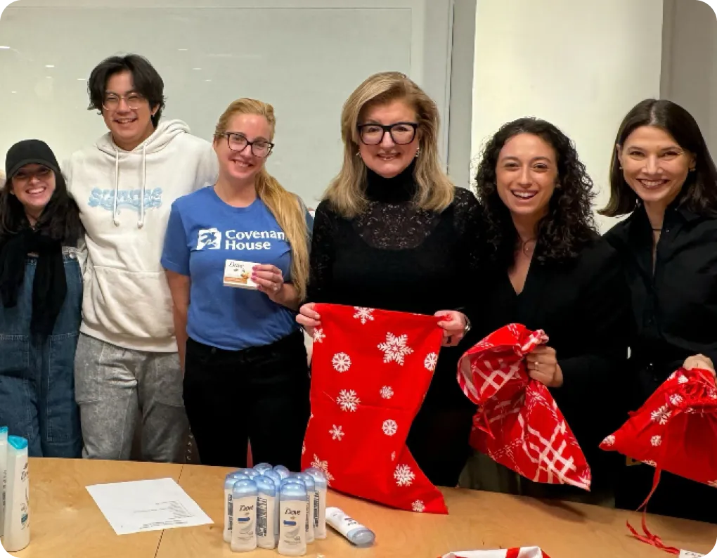 thrive volunteer group putting Christmas gifts in bags